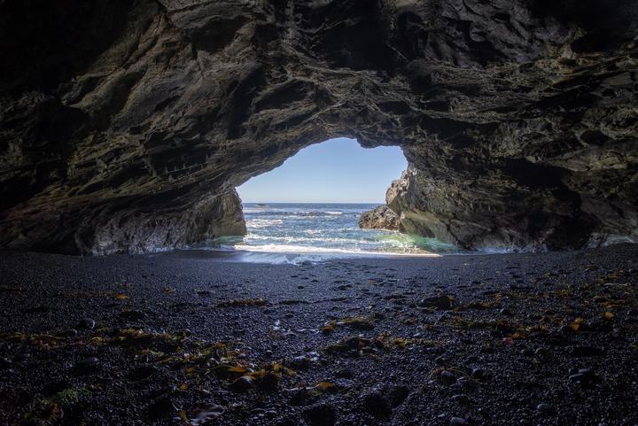 Ocean view framed by the mouth of a sea cave