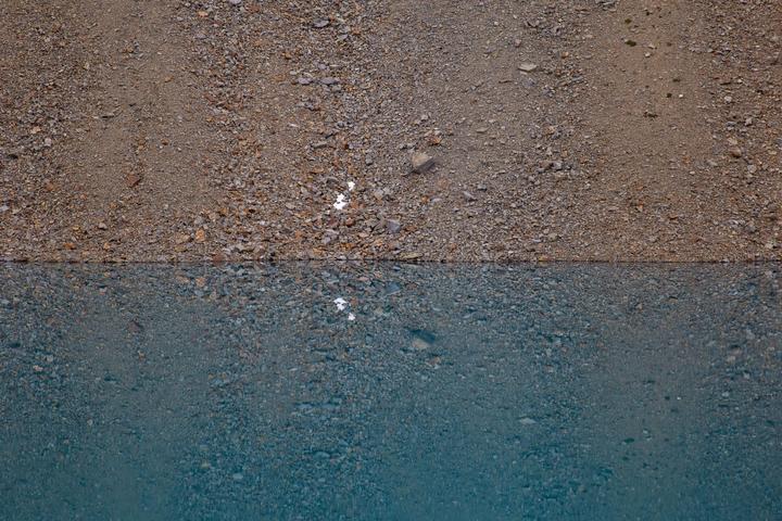Sandy shore meeting turquoise water